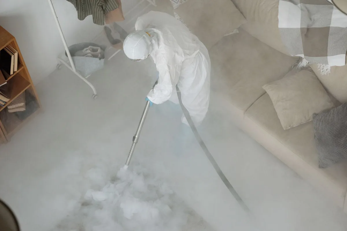 Biohazard cleanup technician in protective equipment, Panama City Beach, FL